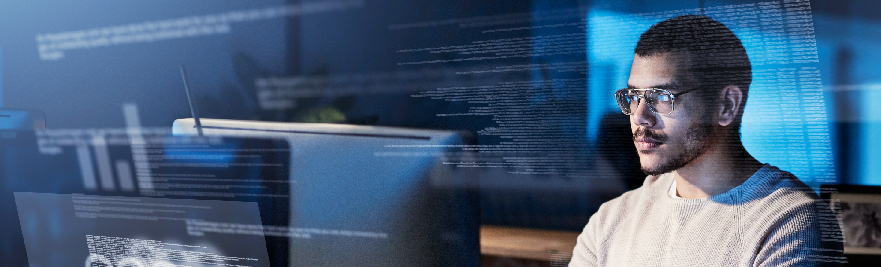 Case Study: Global Total Workforce Management Implementation . A man with glasses looks into a computer.